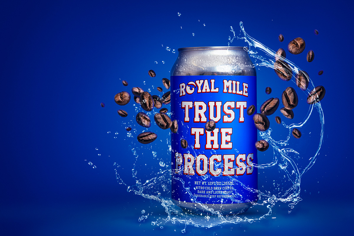 Royal Mile Trust the Process canned coffee commercial product campaign with coffee beans and a water splash